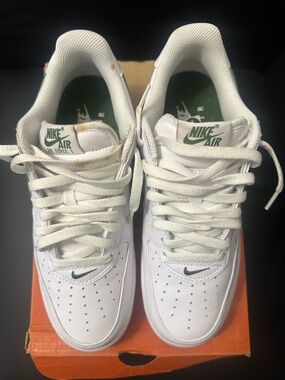 Nike White Low Air Force 1s Sneakers with Green Accents & gum bottoms